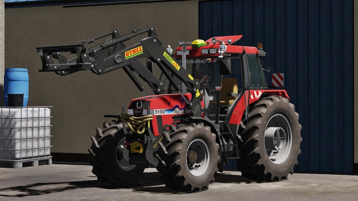 fs22-mods, FS22 mod Case IH Maxxum 5100 Series tractor with front loader parked in front of a barn in Farming Simulator 22.