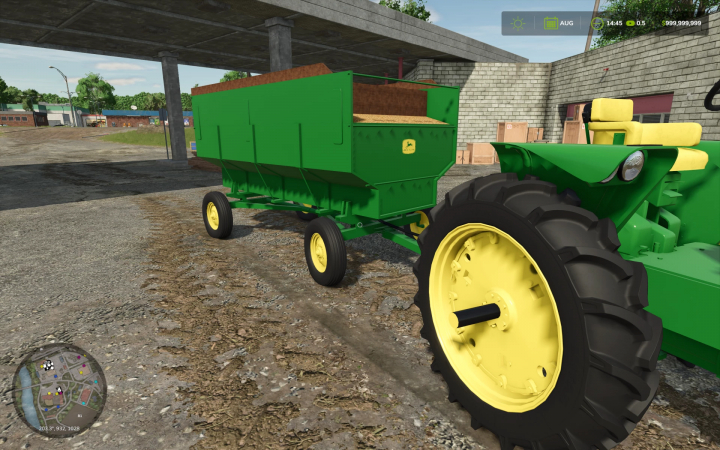 fs25-mods,  John Deere Barge Wagon in FS25 mod, green wagon hitched to tractor, in a farmyard.