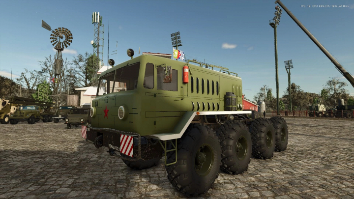 fs25-mods,  MAZ 7310 military truck mod in FS25 with a green body, parked on cobblestone in Farming Simulator 25.