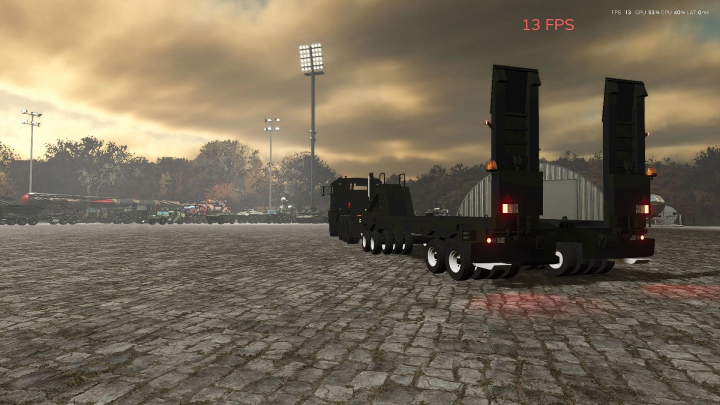 fs25-mods,  Ural 4320 mod in FS25 showcasing a truck in a cobblestone yard at dusk with a lit stadium and vehicles in the background.