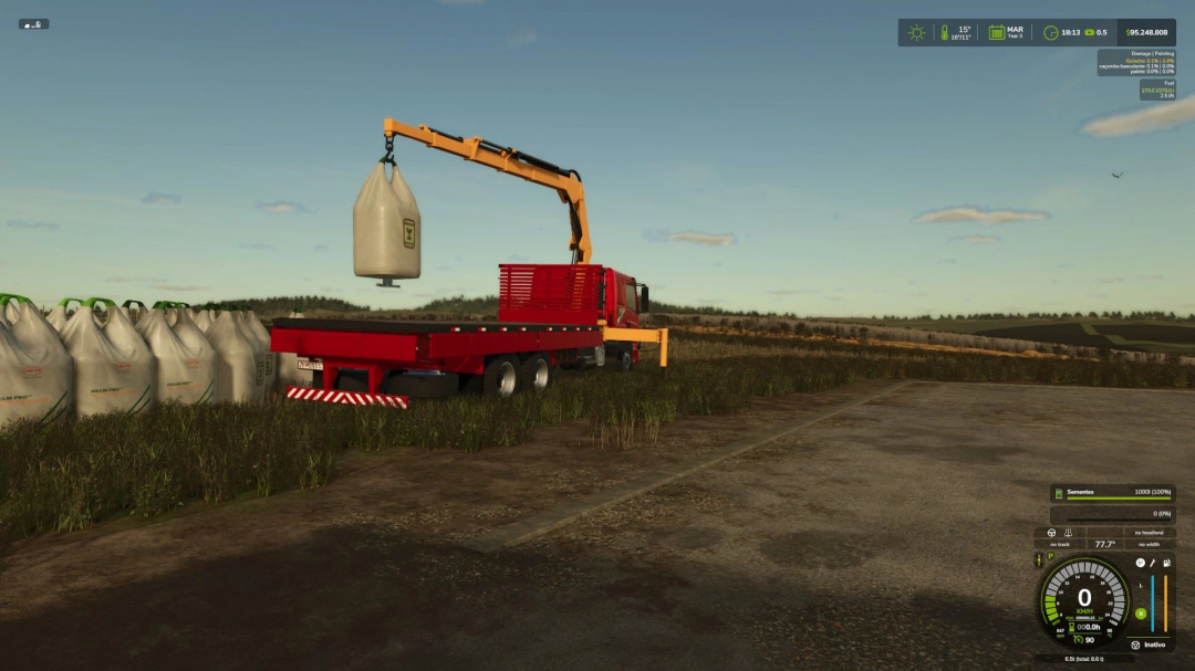 Farming Simulator 25 mod ATEGO MUNCK v1.0.0.0: A red truck with a crane loading a large sack onto its flatbed in a field.