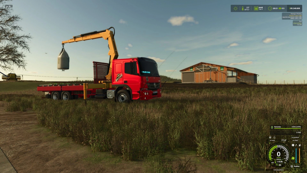 FS25 mod ATEGO MUNCK v1.0.0.0 displaying a red truck with a yellow crane lifting a bag in a field.