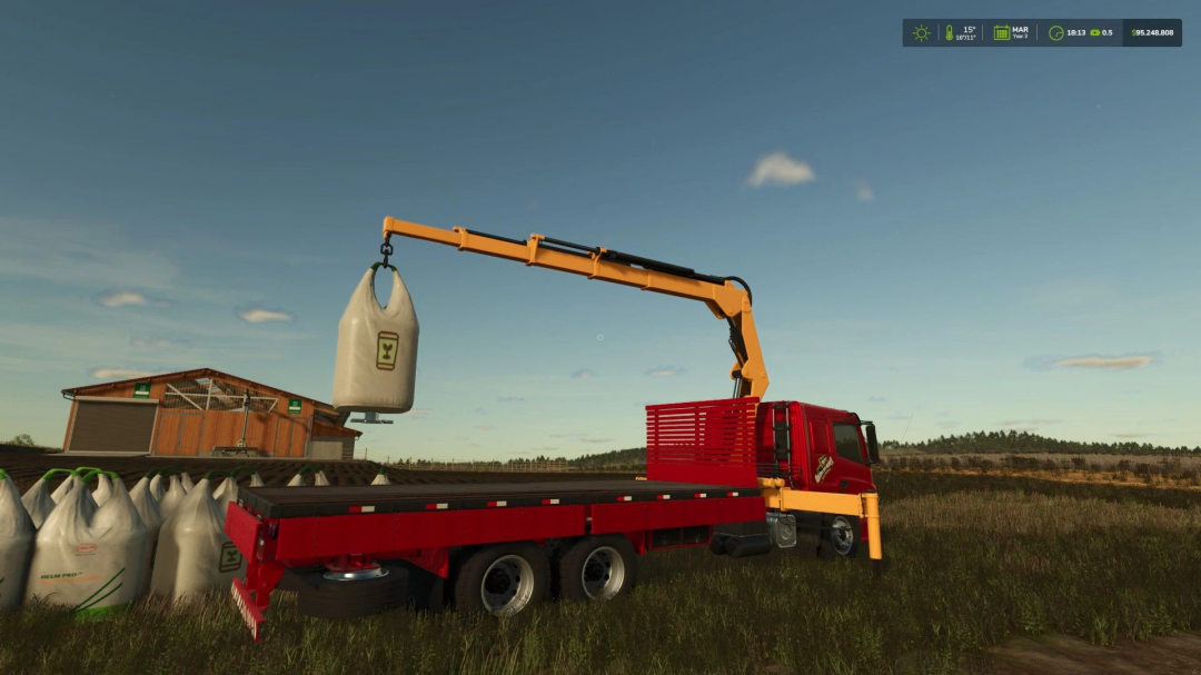 FS25 mod ATEGO MUNCK v1.0.0.0 shows a red truck with a crane lifting a large bag in a farm setting.