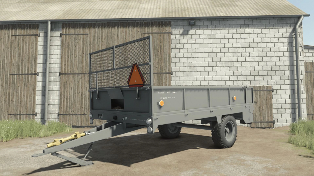 Agromet Warfama N-237/1 trailer mod in FS25 outside a barn.