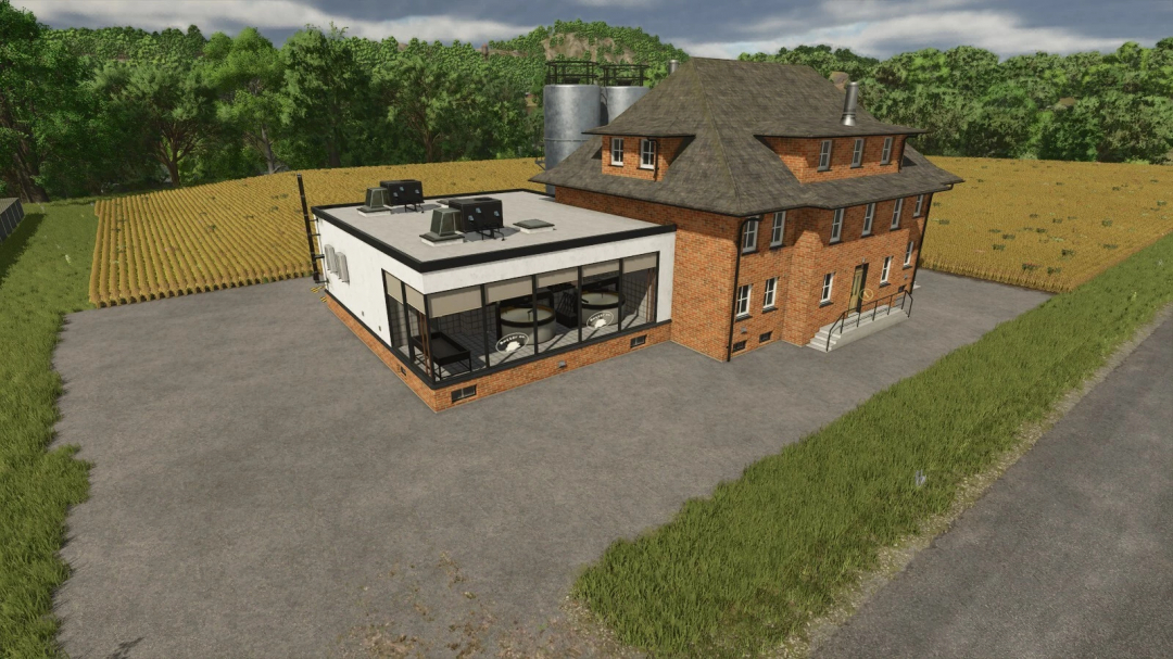 FS25 mod Butter Co. Factory with brick building and farmland background.