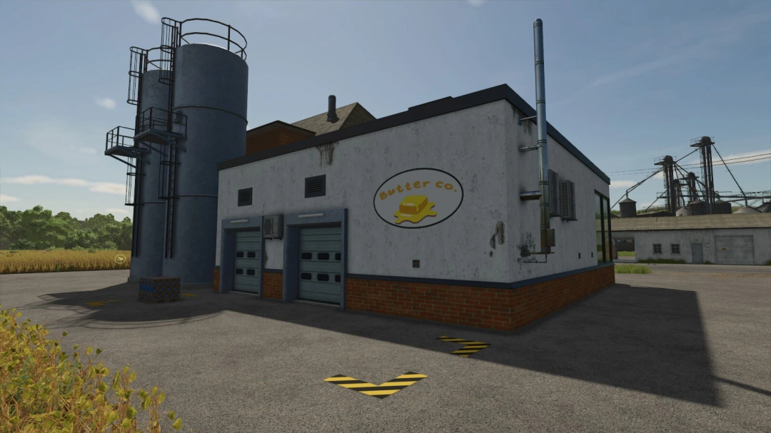 Butter Co. Factory mod for Farming Simulator 25 featuring industrial building with silos.