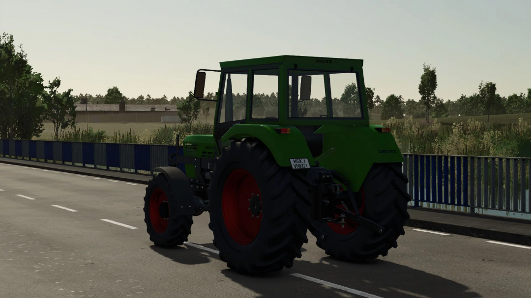 Deutz D06 tractor mod in FS25, showing its green exterior on a rural road.