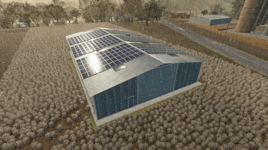 FS25 mod Extra Large Workshop v1.0.0.0, a large blue building with solar panels on the roof, set in a snowy farm landscape.