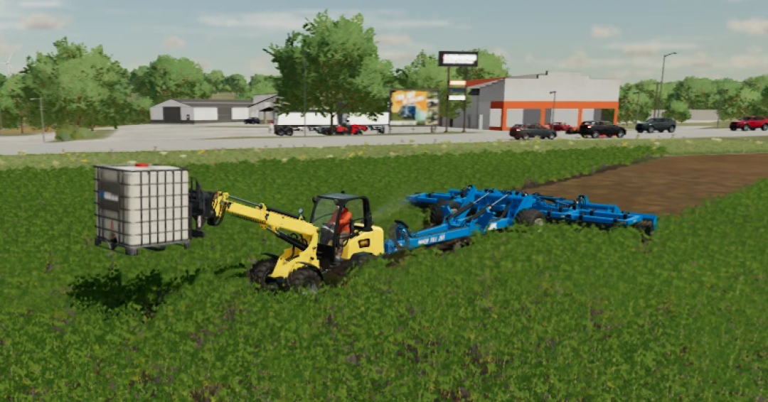 Gehl ALT950 Wheel Loader mod in FS25 moving a container in a field beside farm buildings and vehicles.