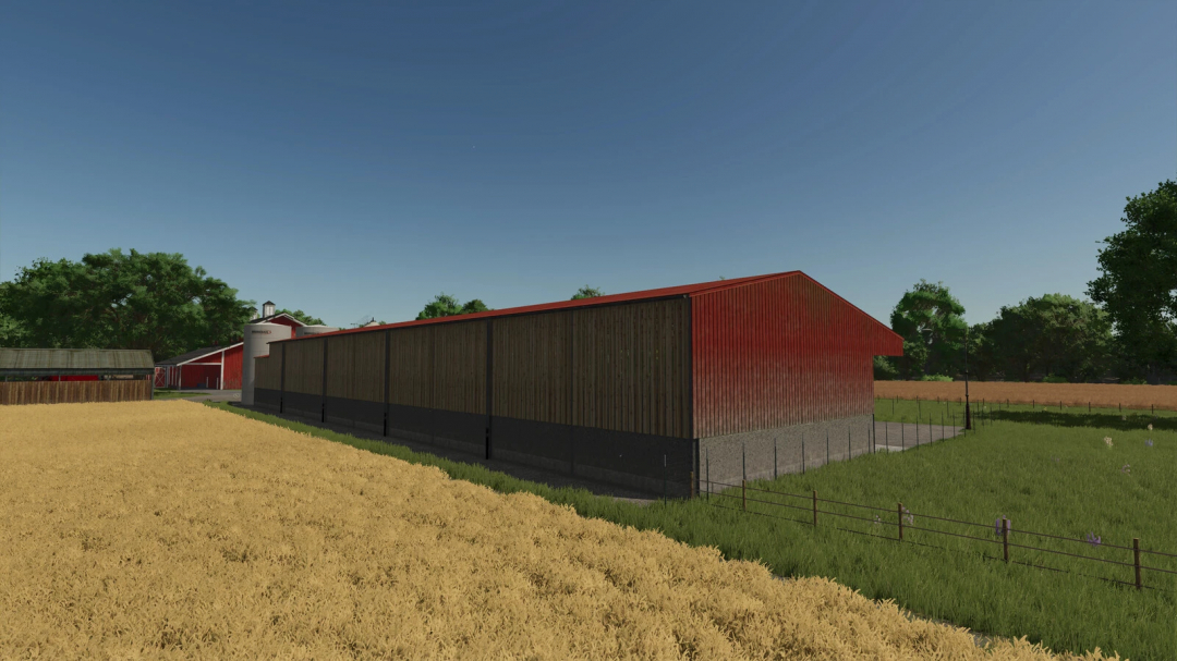 Grain Hall mod in FS25 with red and wooden structure beside a wheat field.