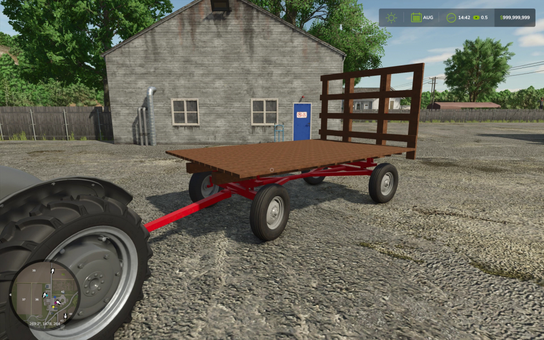 John Deere Barge Wagon mod in Farming Simulator 25, showing a red flatbed trailer with wooden sides near a building.