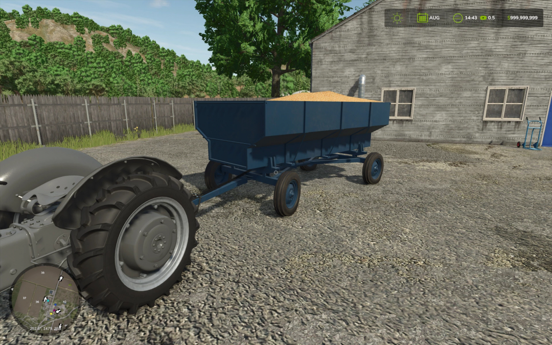 FS25 mod showing John Deere Barge Wagon loaded with grain attached to a tractor.