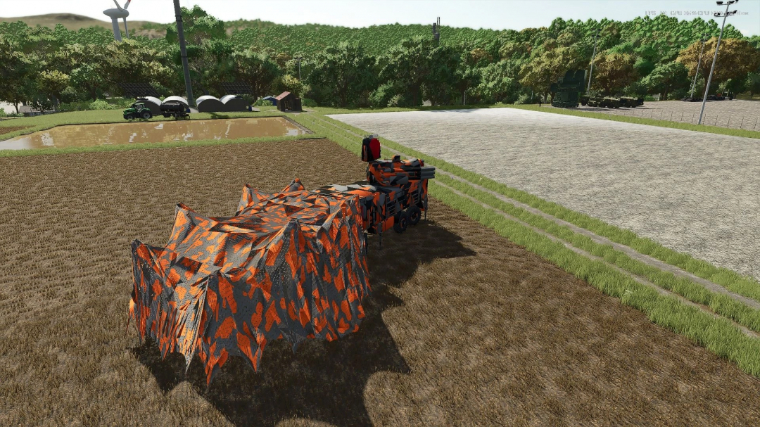 Kamaz 1204 URR v1.0.0.0 mod in FS25, showcasing a unique camouflage design on a field.