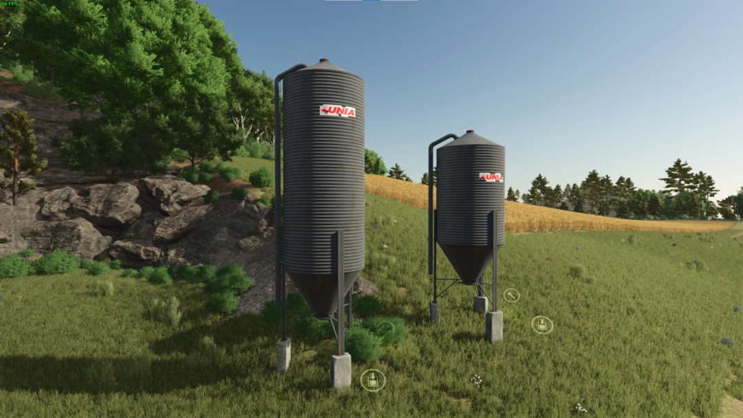 FS25 mods: Karma Silo Bins v1.0.0.0 in a grassy field landscape.