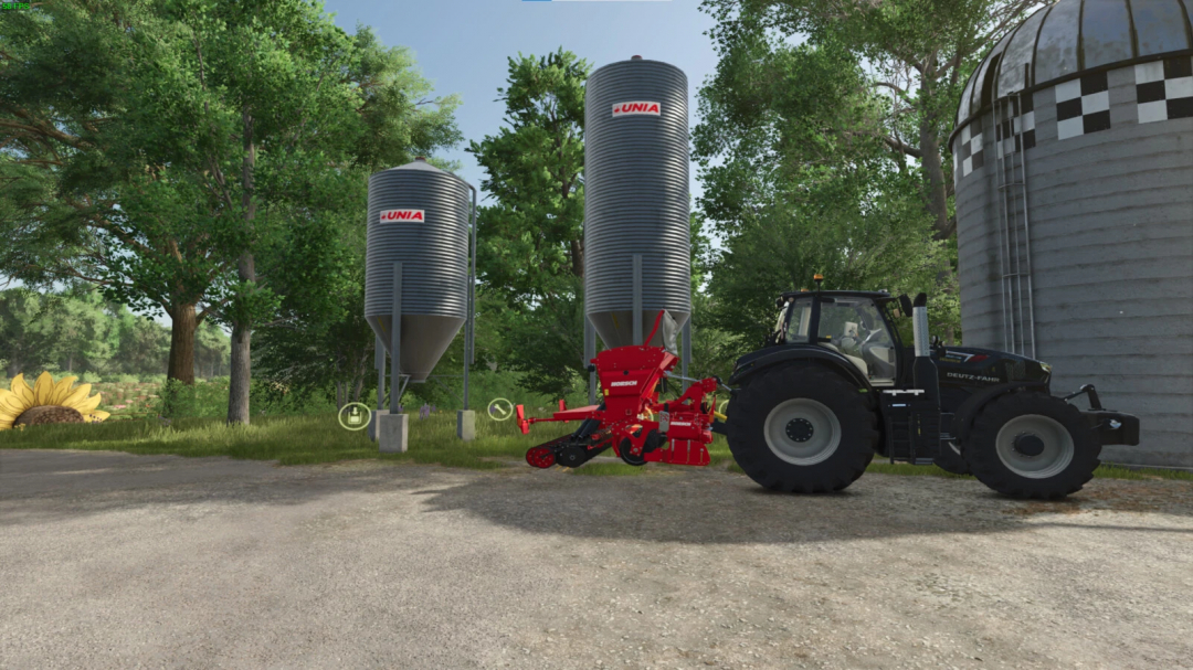 Two Karma Silo Bins in FS25 mod with a tractor and trees in the background.