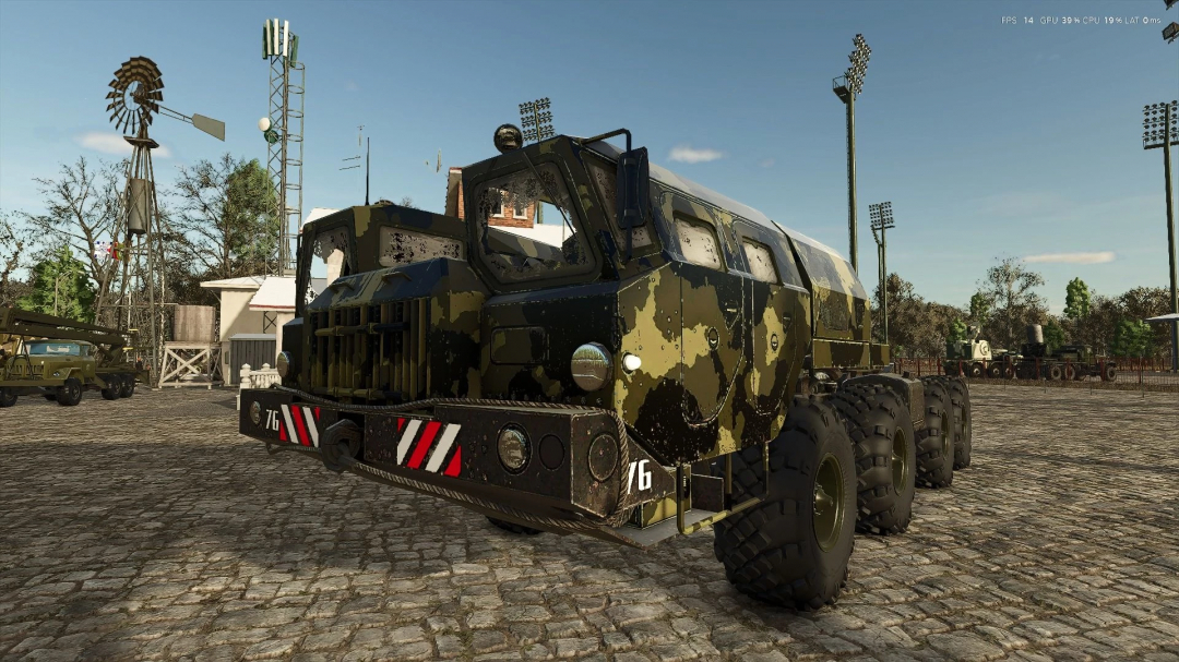 Camouflage truck in MAZ MF Pack mod for FS25 on cobblestone street, featuring a windmill and towers in the background.