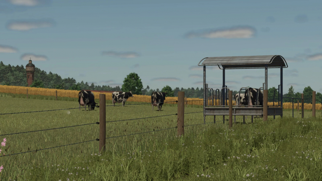 Meadow Fence Pack v1.0.0.0 in FS25 mod featuring cows grazing in a fenced field with a feeder.