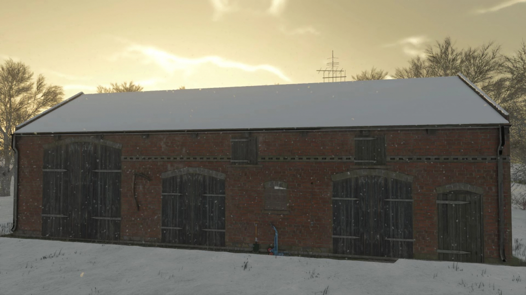 FS25 mod Post German Barn in winter scenery with snow covering the ground.