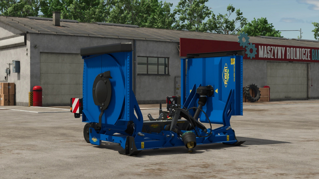 FS25 mod ROBERT F4700 v1.0.0.0 showcasing a blue agricultural implement in front of a shed.