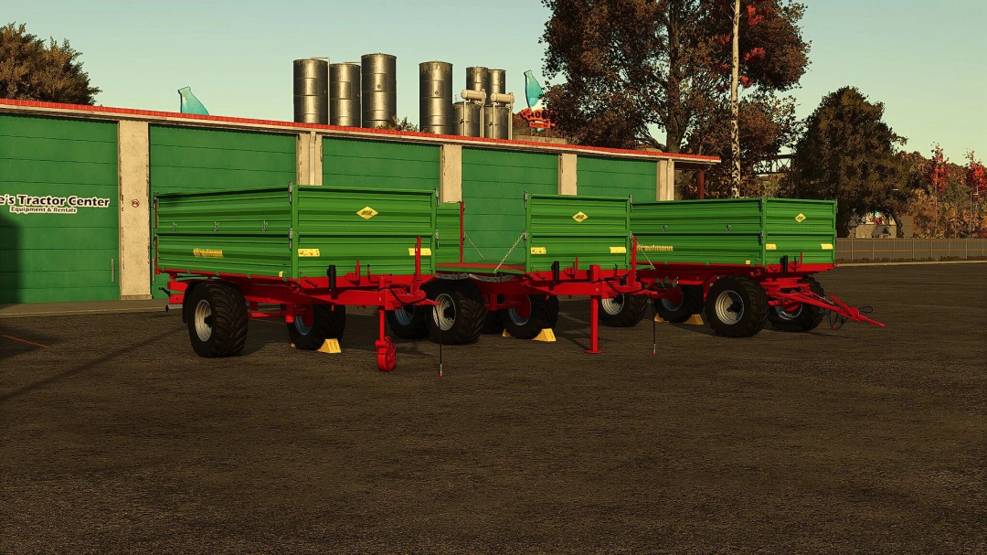 Stuutmann trailer pack v1.0.0.0 in Farming Simulator 25, featuring green trailers with red frames at a tractor center.