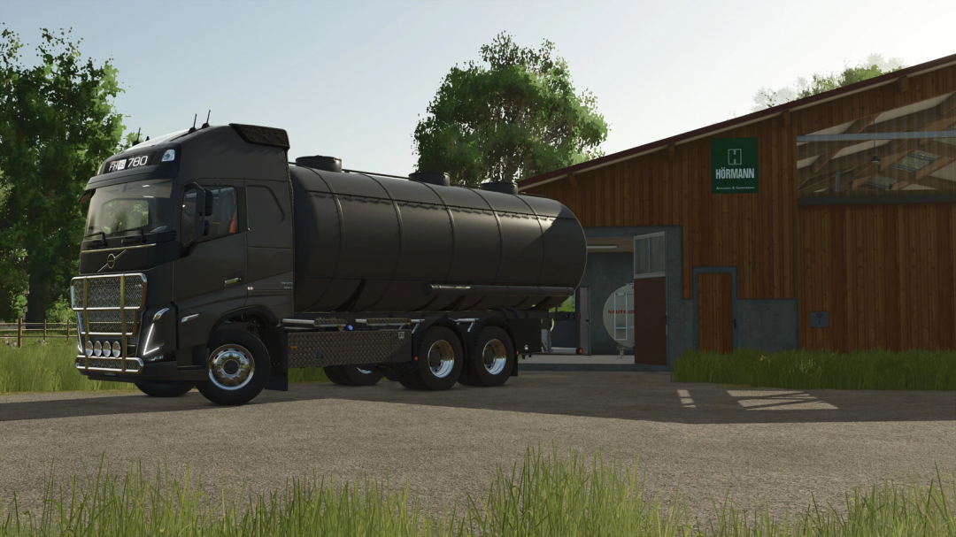 Volvo FH16 Tanker mod in FS25 parked beside a wooden barn, showcasing Farming Simulator 25 mods.