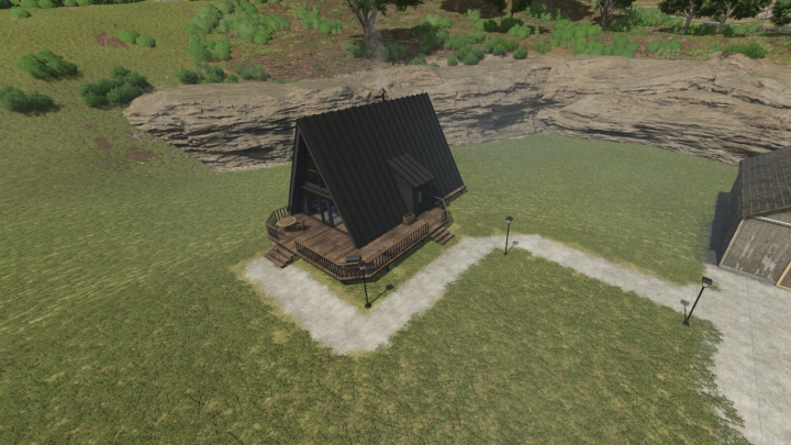 fs25-mods, A-Frame Cabin mod in FS25 game, nestled in green terrain with rock backdrop.