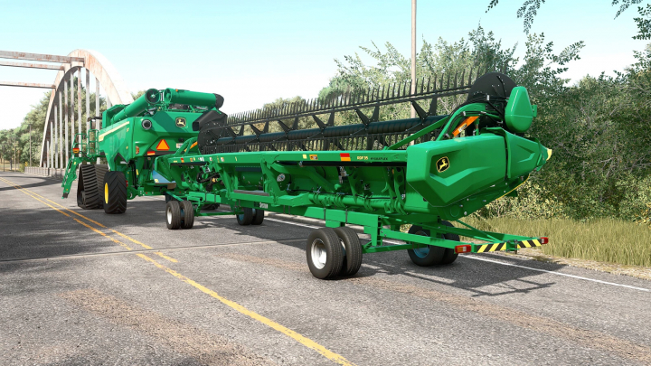 fs25-mods,  FS25 mod John Deere GreenSystem Trailer Pack v1.0.0.0 on a road with a bridge in Farming Simulator 25.