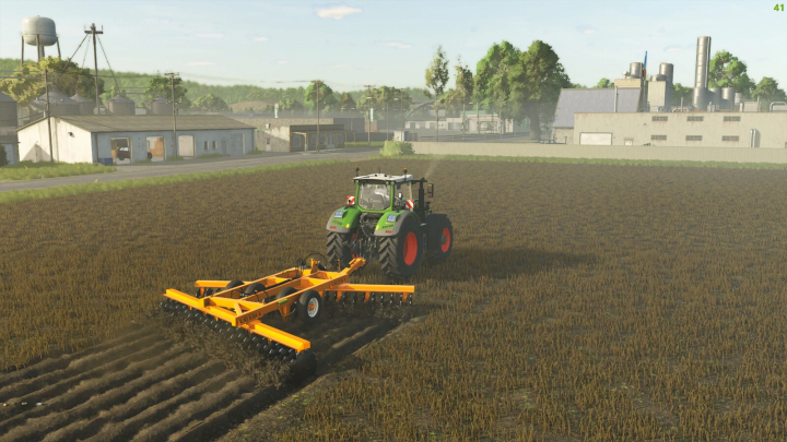 fs25-mods,  Tractor using Lizard SAC Pack mod in FS25, cultivating a field near industrial buildings.