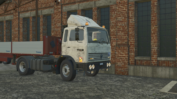 fs25-mods,  Renault G210 semi truck mod for Farming Simulator 25 parked beside a brick building.