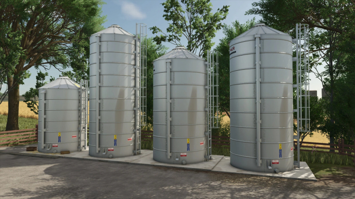 fs25-mods,  FS25 mods image showing Small New Silos v1.0.0.0 in a farm setting. Large metal silos surrounded by trees.