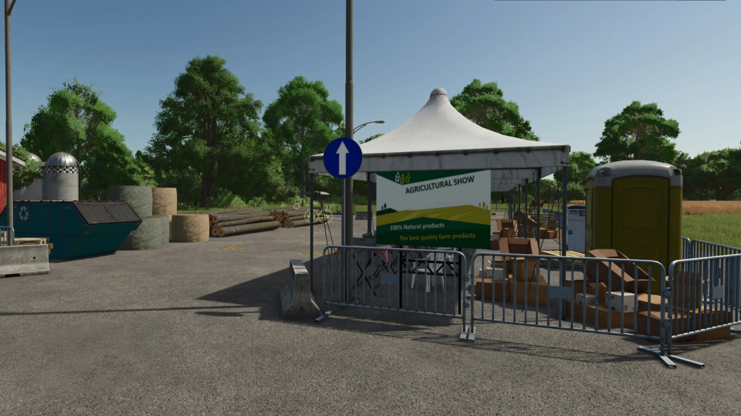 FS25 mod Agricultural Fair v1.0.0.0 shows a tent with agricultural display, surrounded by trees and farming equipment.