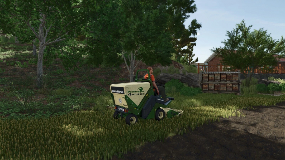 Amazone Profihopper mod in FS25 mowing grass near trees and farm building.