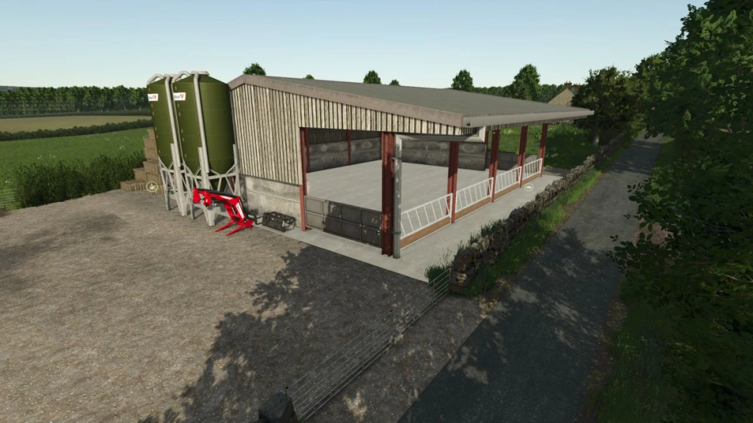 British cattle shed mod in Farming Simulator 25, featuring a large barn with silos and farming equipment.