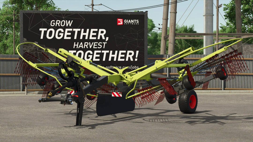 CLAAS Liner 2700 mod in Farming Simulator 25, showcasing its complex rake design with a backdrop of a motivational billboard.