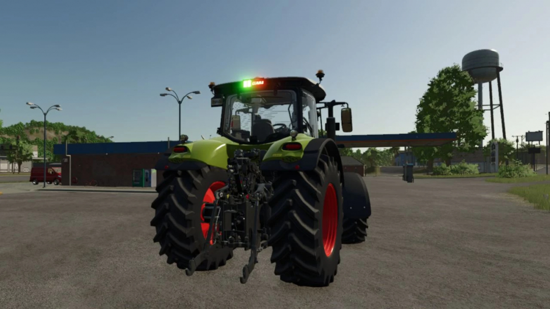 Rear view of a Claas Axion 800 tractor mod in FS25, showcasing detailed design and rural background.