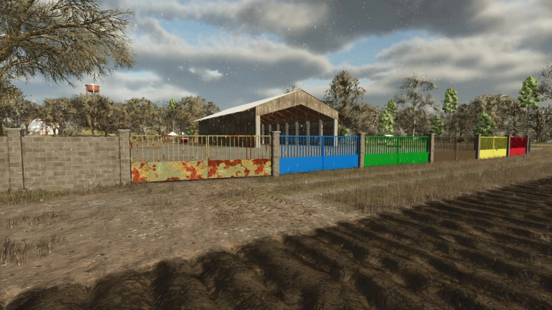 Colorful concrete fences in FS25 mod Concrete Fences v1.0.0.0 surrounding a barn.