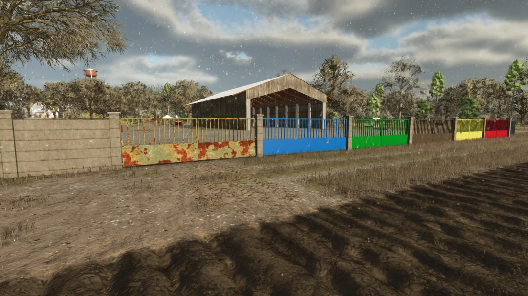 Concrete fences mod for FS25 featuring colorful gates next to a barn.