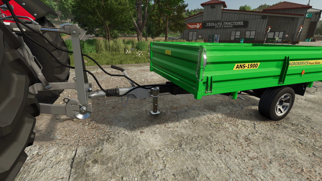 FS25 mod Farm Rail Triangle v1.0.0.0 shows a green trailer attached to a tractor near Yeollyo Tractors shop.