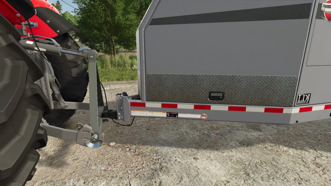 Close-up of Farm Rail Triangle mod in FS25, showing tractor hitch and trailer details.