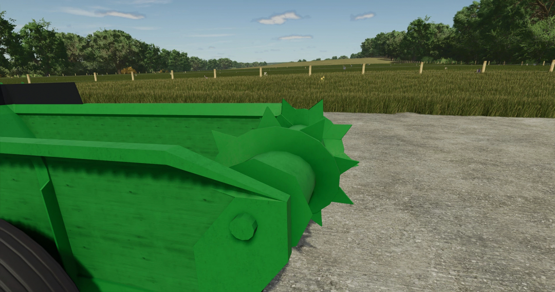 Close-up of John Deere 34 Manure Spreader in FS25 mod, showing green metal structure in a field.