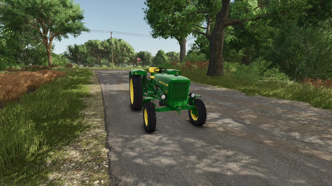 John Deere 710 mod in Farming Simulator 25, showing a green tractor on a rural road.