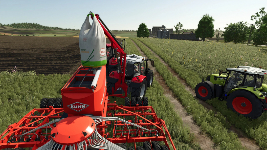 FS25 mods gameplay showing Lizard Bigbaglift lifting a bag over Kuhn machinery in a field.