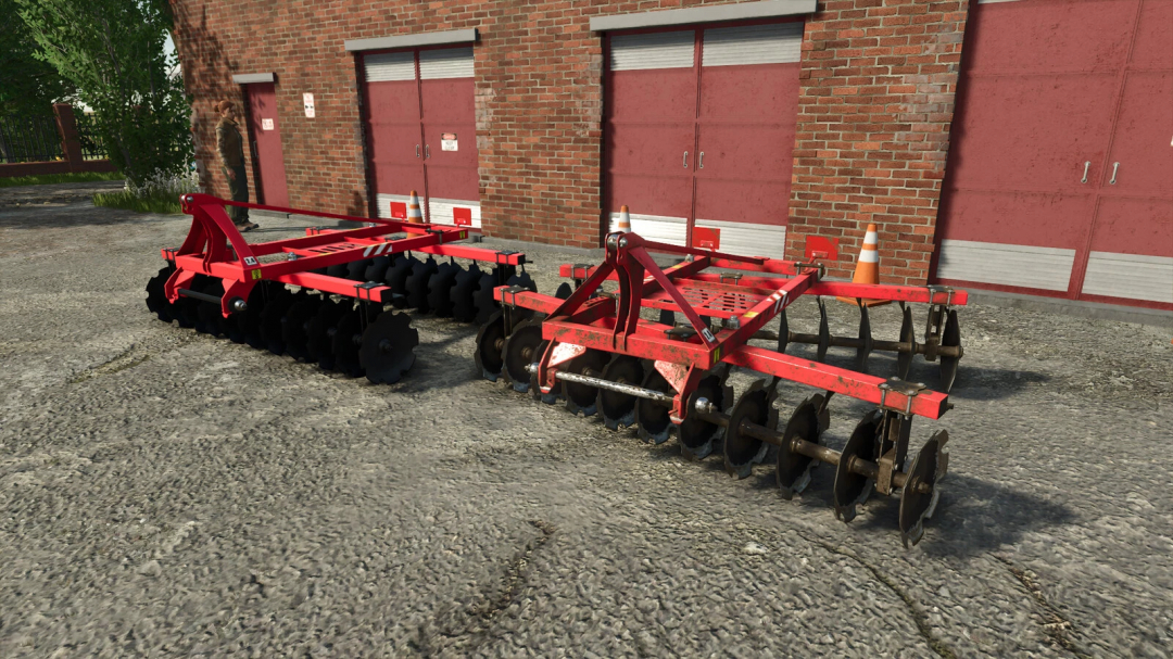 Lizard Disc Harrow 2.4 v1.0.0.0 mod for FS25, featuring red disc harrows in front of a brick building.