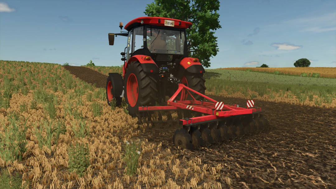 FS25 mod Lizard Disc Harrow 2.4 v1.0.0.0 attached to a tractor, working on a field in Farming Simulator 25.