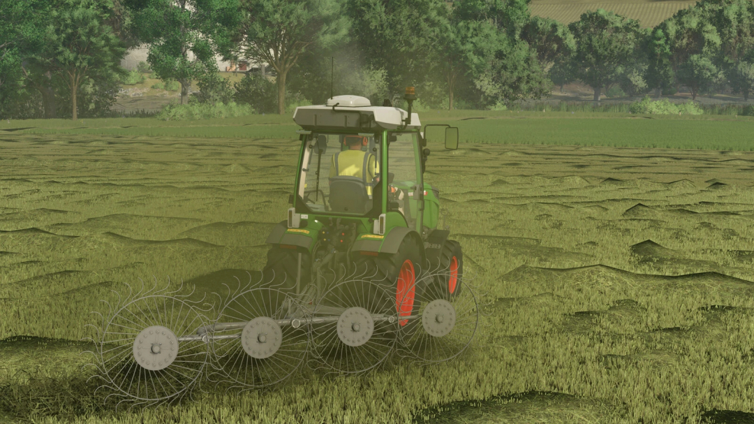 FS25 mod Lizard Z-240 v1.0.0.0, showing a tractor raking a field with lush green trees in the background.