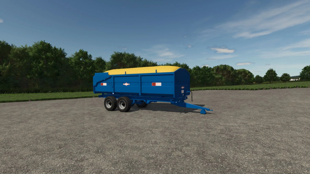 Marston Trailer Pack in FS25, featuring a blue and yellow trailer in a field setting.