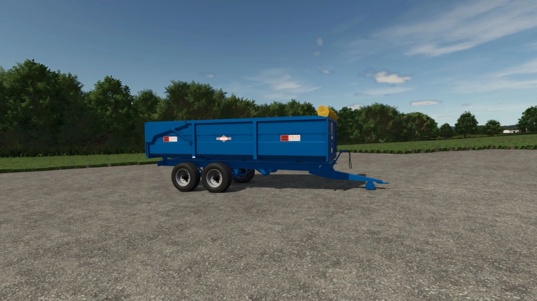 Marston Trailer Pack v1.0.0.0 mod for FS25 featuring a blue trailer on a paved area with trees in the background.