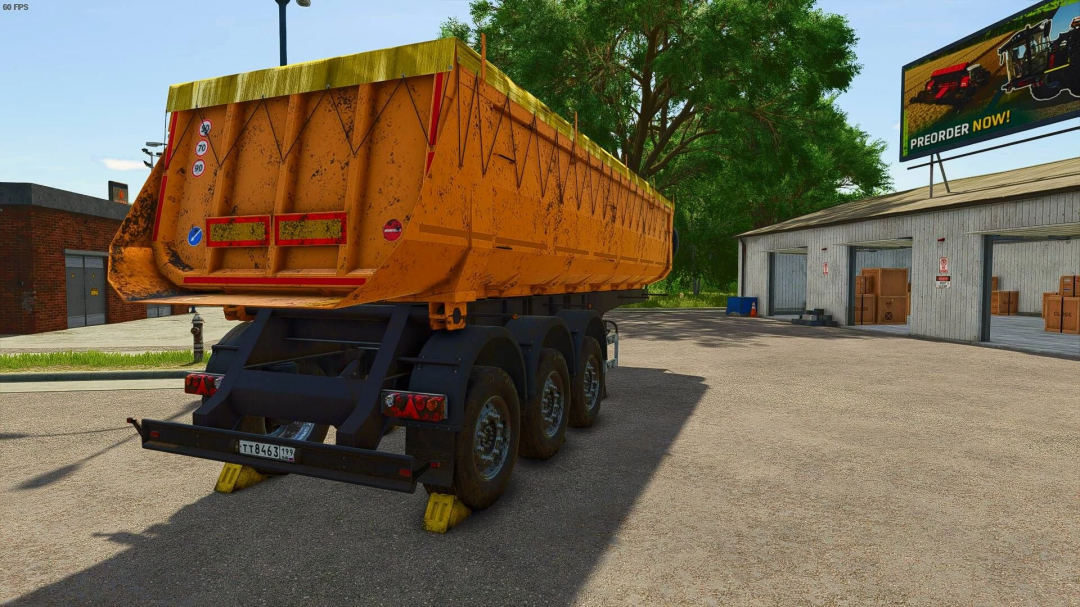 FS25 mod NEFAZ 9509 semi trailer parked in a yard next to a warehouse in Farming Simulator 25.