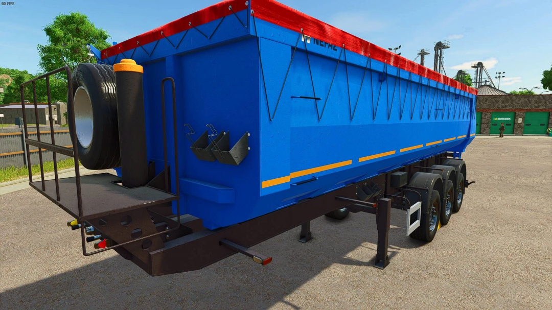 FS25 mod NEFAZ 9509 semi trailer v1.0.0.0 in bright blue and red, showcased in Farming Simulator 25.