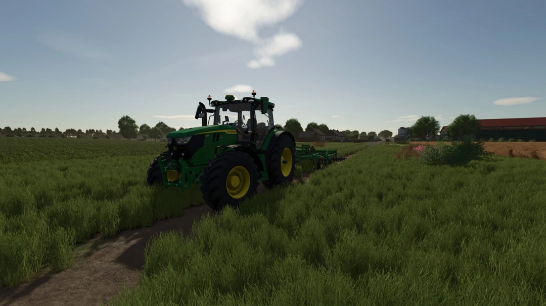 Green tractor on grass field in FS25 New Bartelshagen mod.